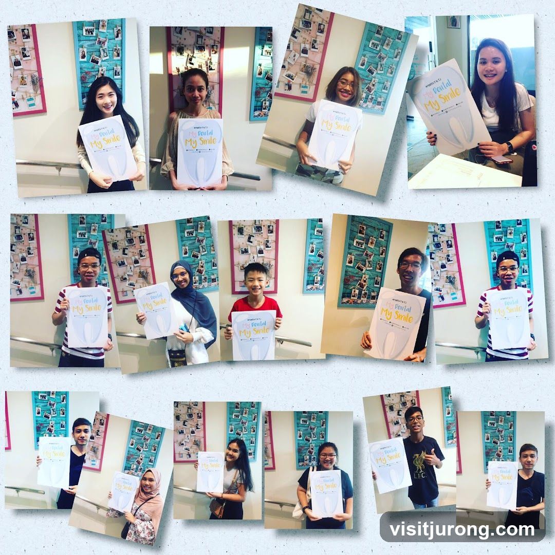 Group of people holding dental posters