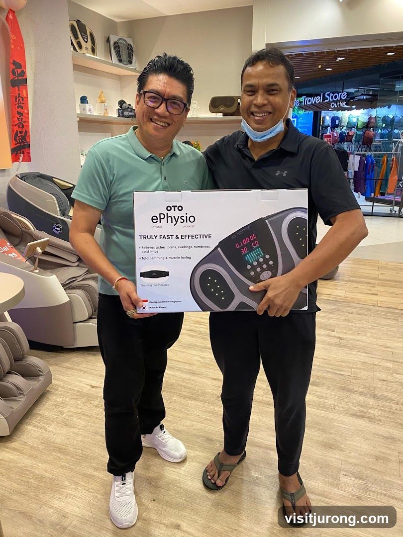 Two men holding a product box