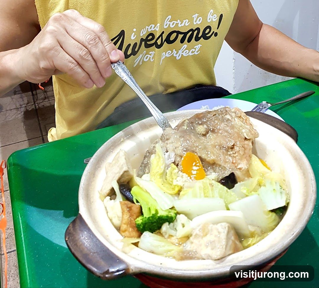 Person eating a clay pot dish