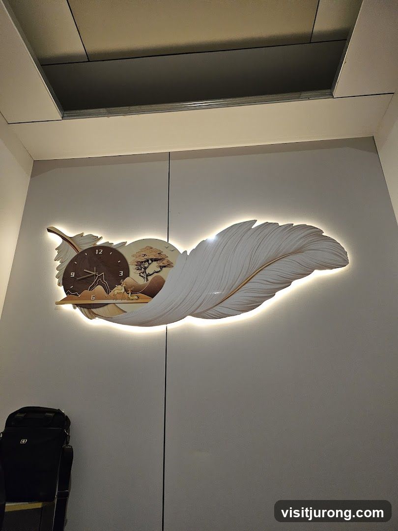 Feather-shaped clock with scenic inlay
