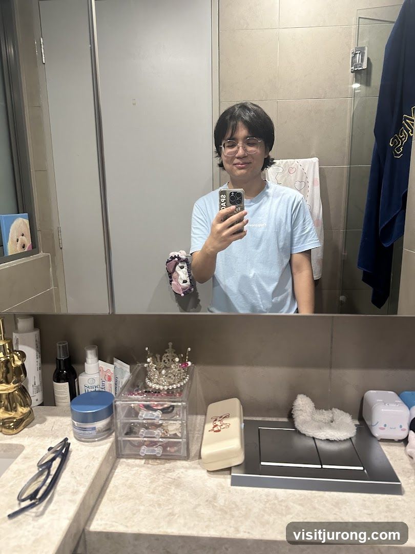 Person taking a mirror selfie in a bathroom