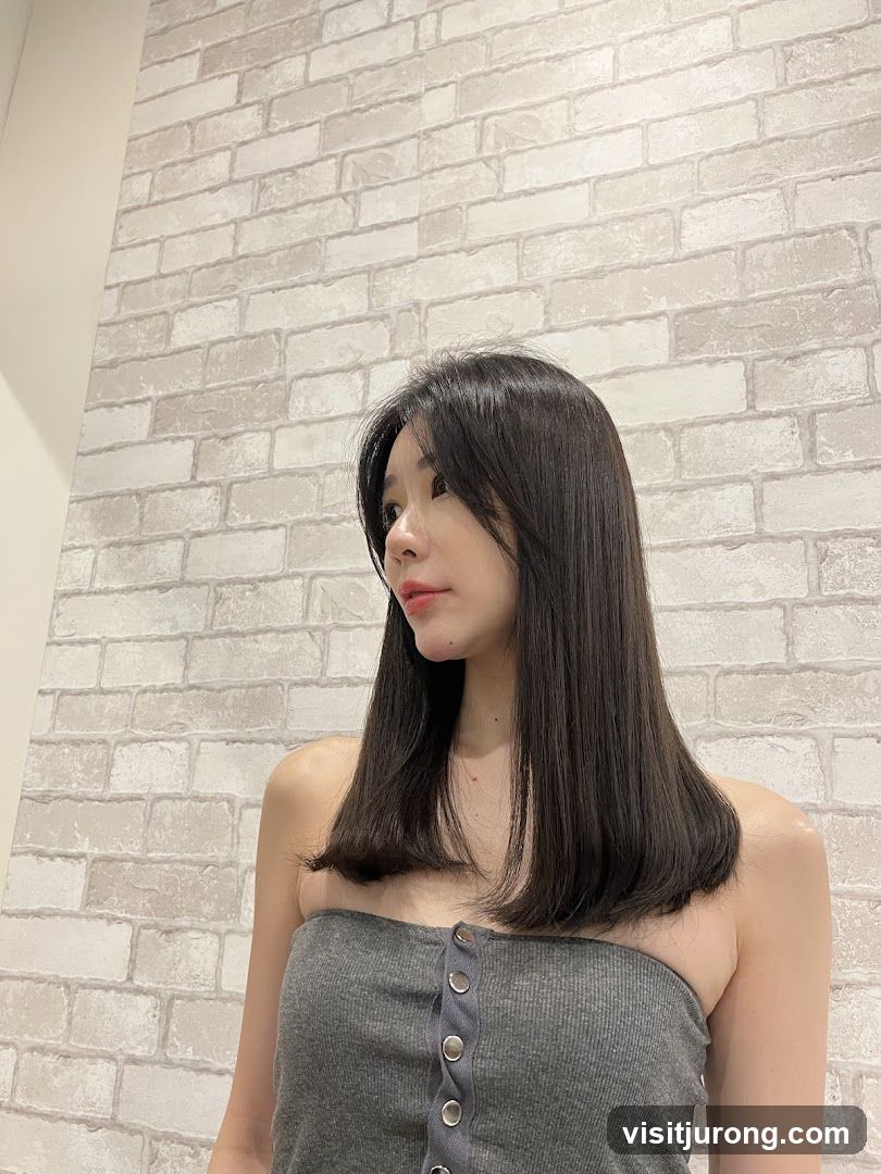 Woman in a grey strapless top