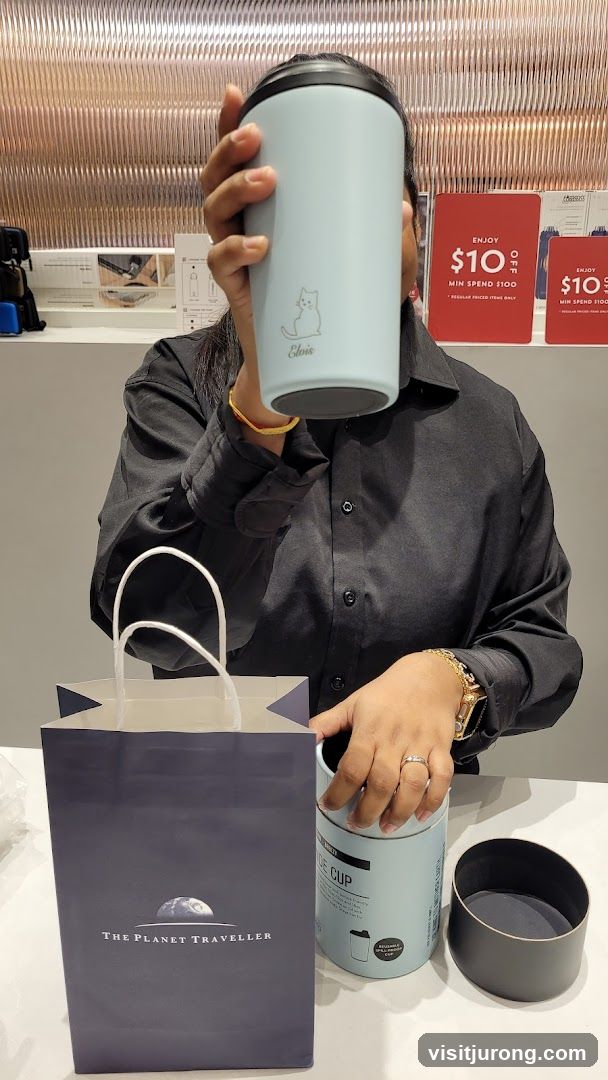 Person holding a reusable cup