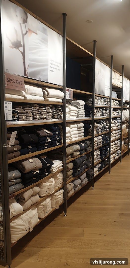 Folded textiles on shelves