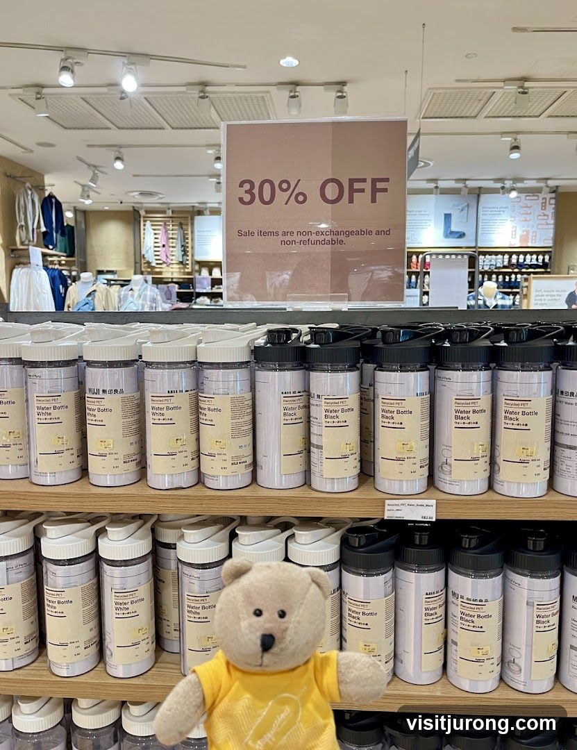 Sale sign and water bottles
