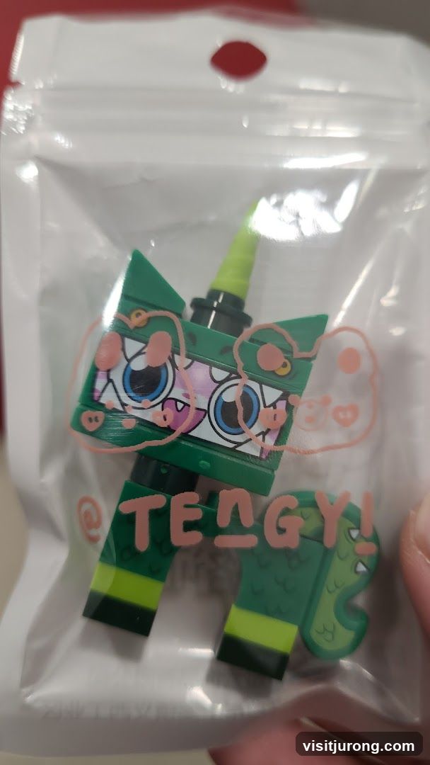 Green Lego-style Figure in Packaging