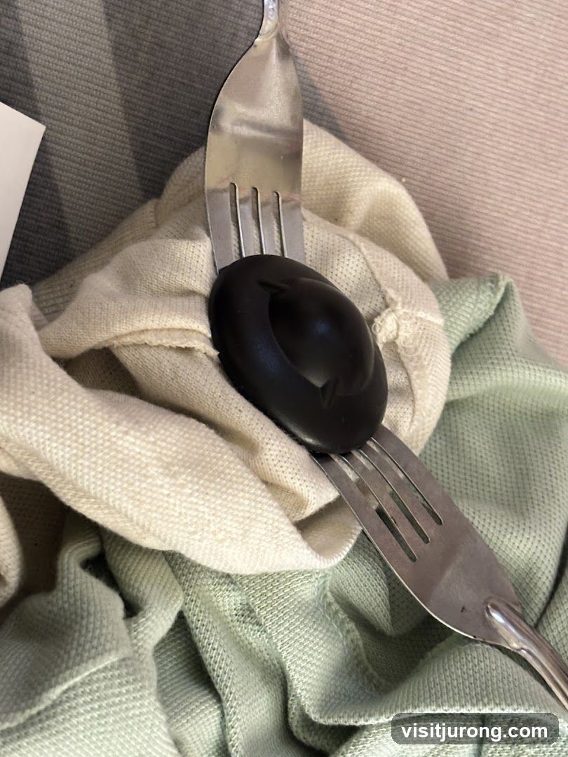Two Forks and a Black Object