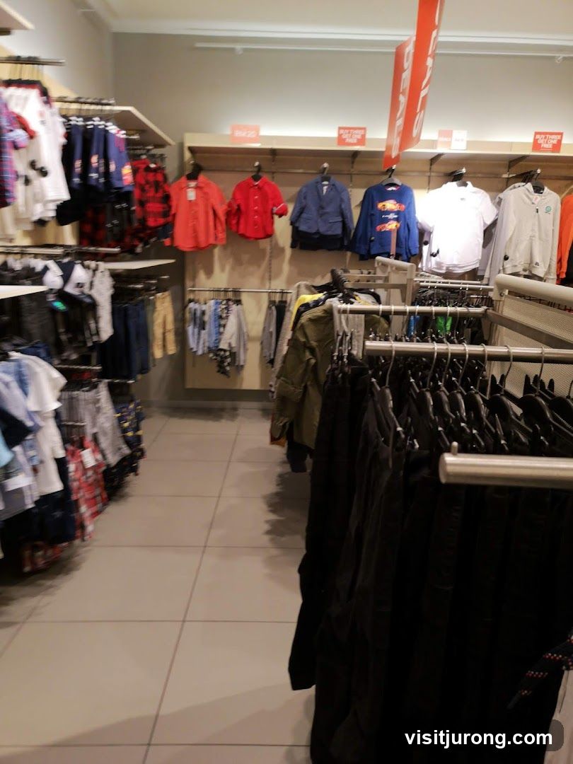 Clothing store aisle with sale signs