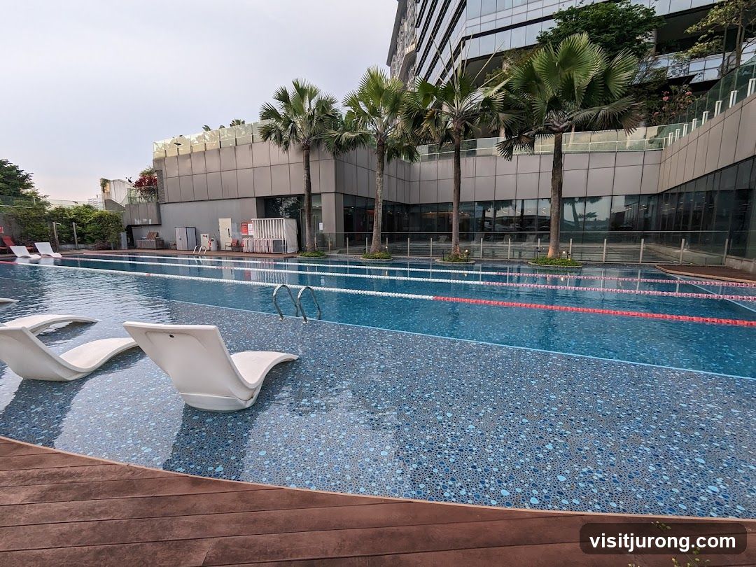 Swimming Pool with Lounge Chairs and Palm Trees