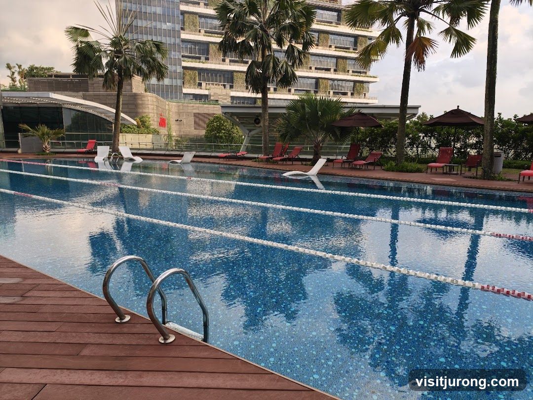Swimming Pool with Lounge Chairs and Palm Trees