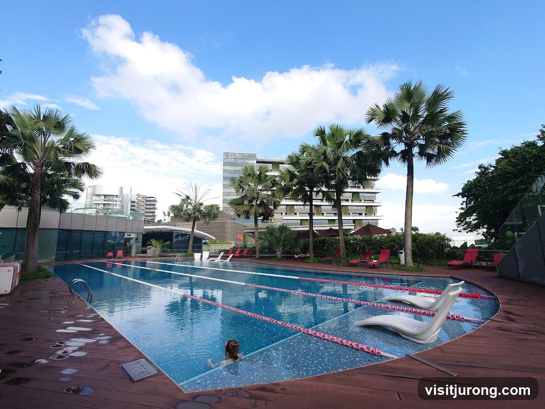 Swimming Pool with Palm Trees and City Buildings