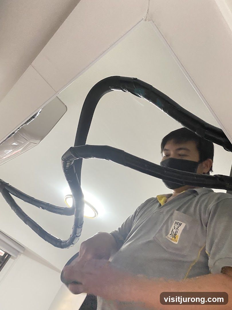 Technician working on air conditioning unit