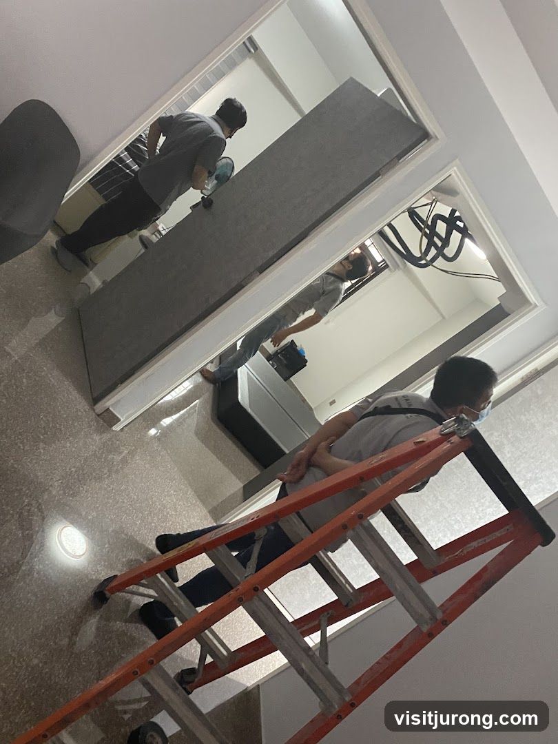 Workers installing a partition