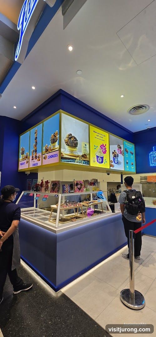 Dessert shop interior with illuminated menu boards