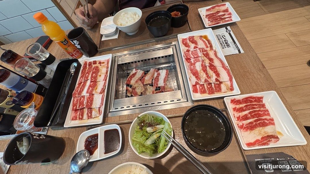 Table with grilled meat and side dishes