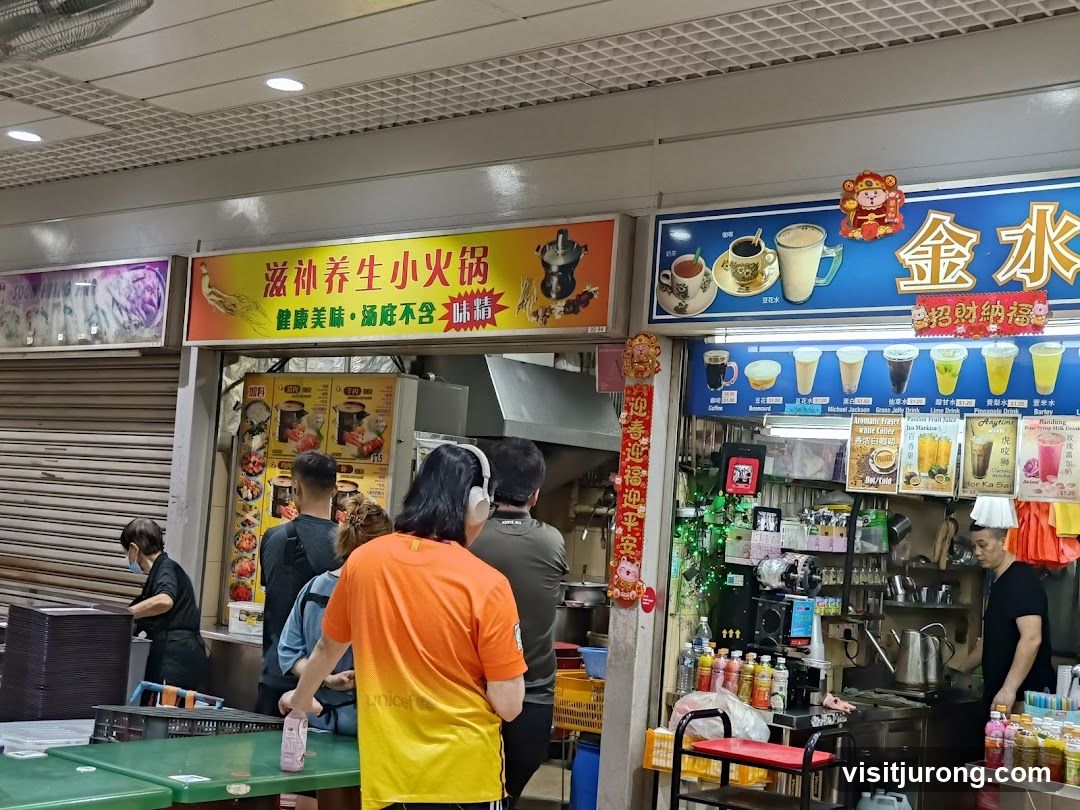 Food stalls with signage and customers