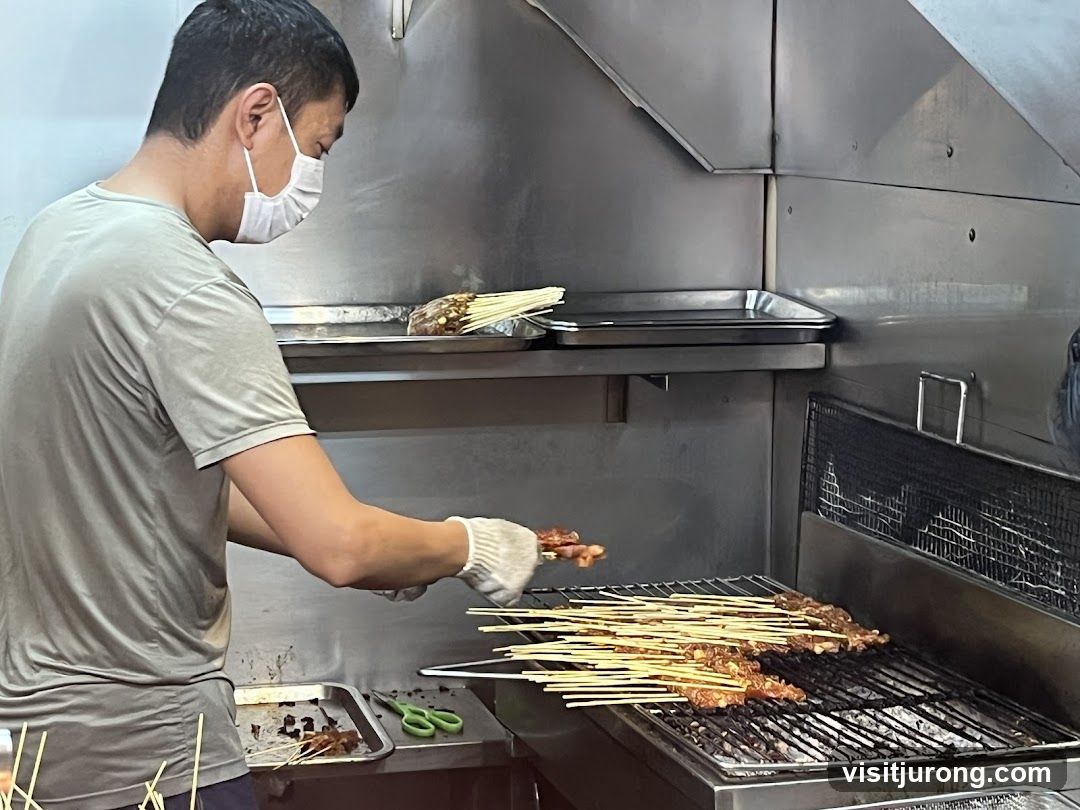 Man grilling skewers