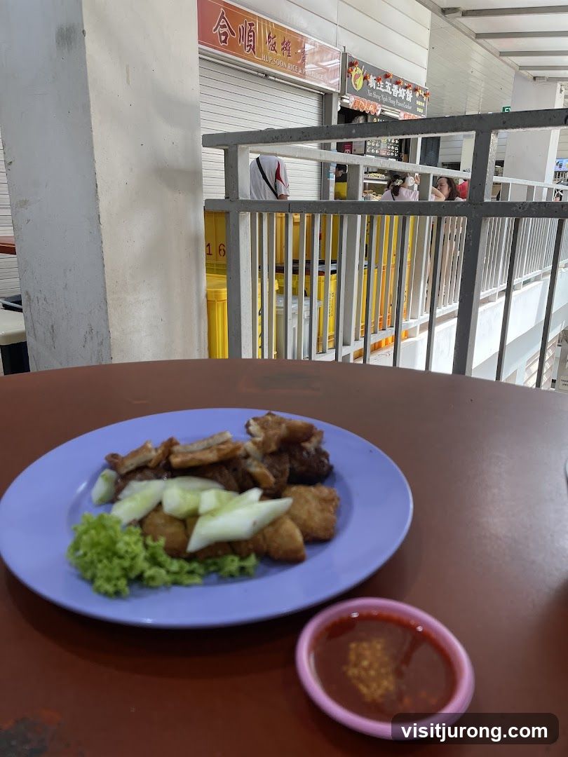 Food on a plate with dipping sauce