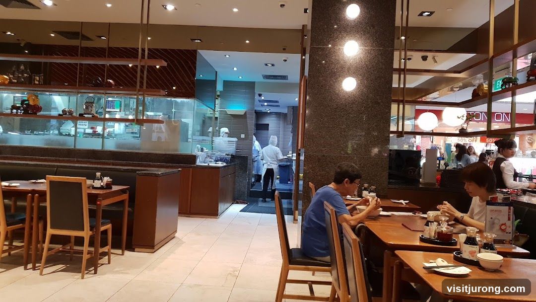 Restaurant Interior with Diners and Kitchen Staff