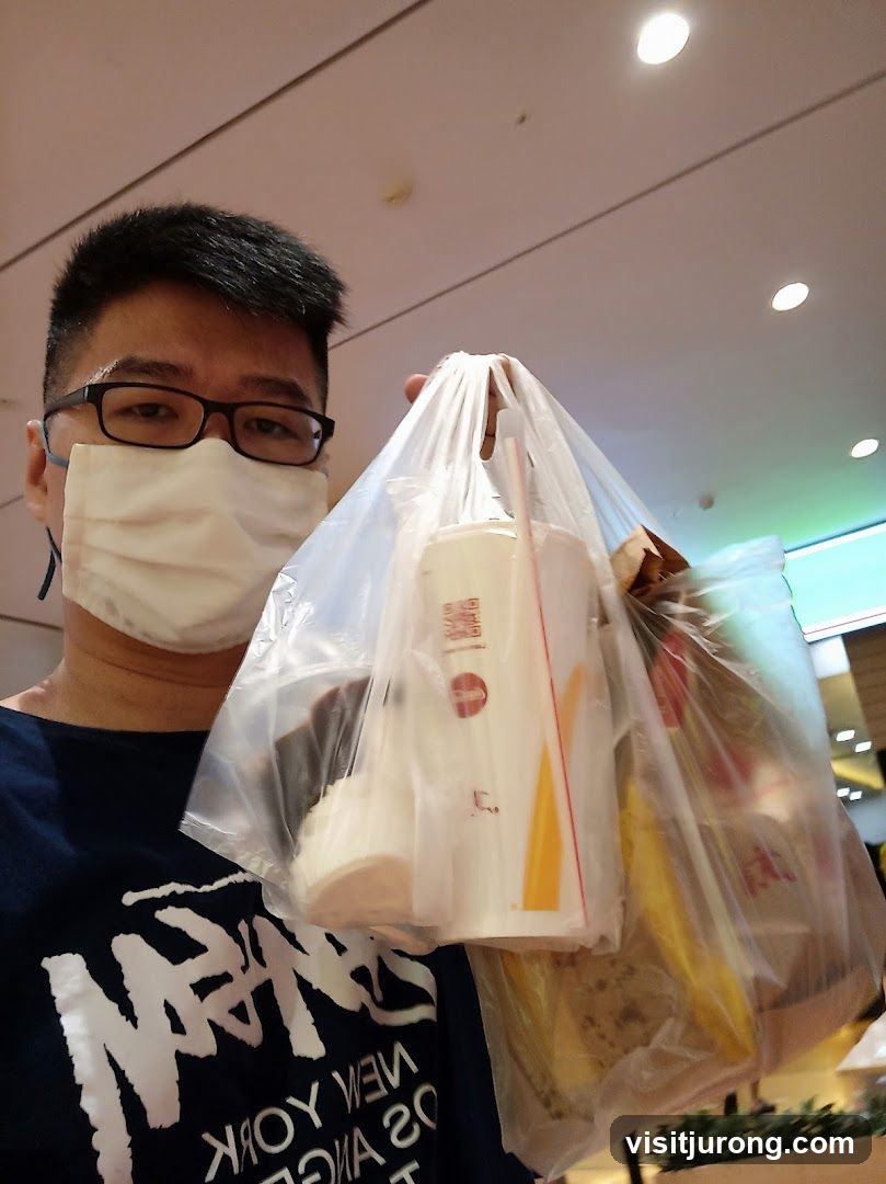 Man holding takeout food bags