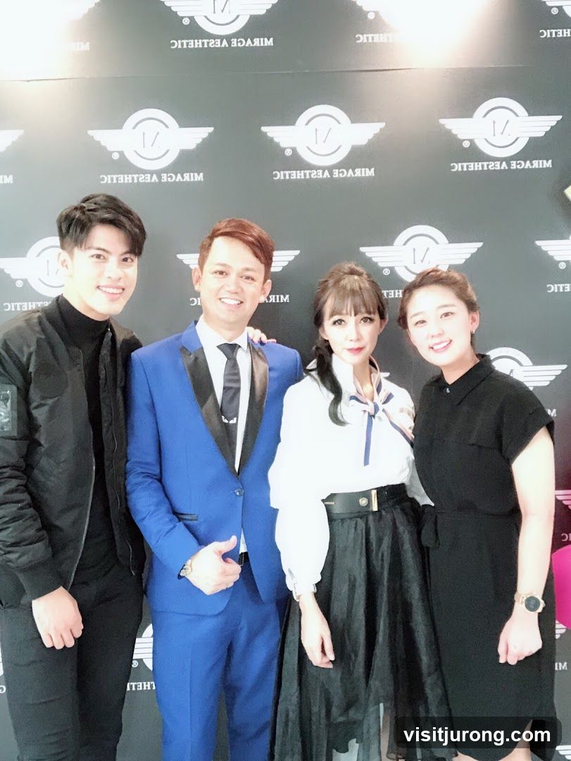 Four people posing for a photo