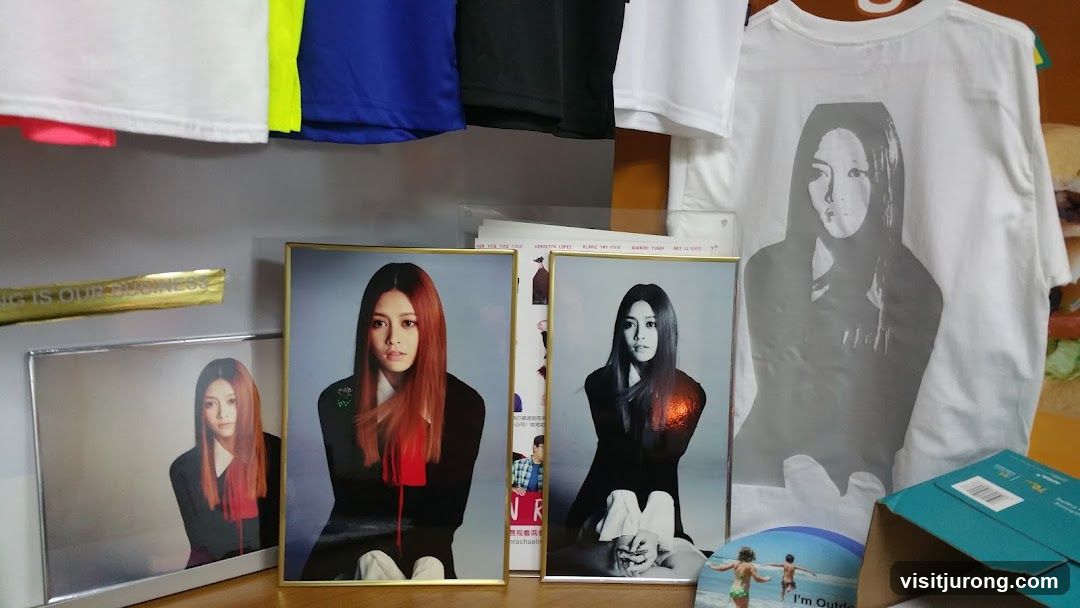 Framed Photos and T-shirt Display