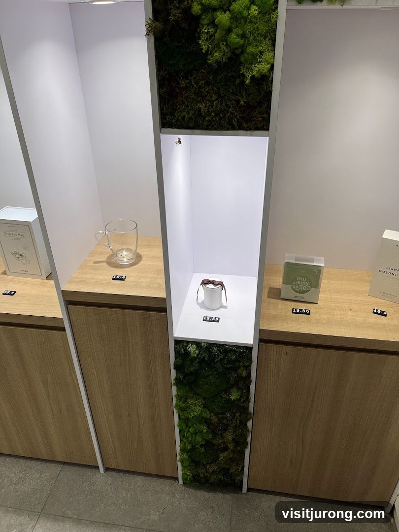 Display shelves with tea products and greenery
