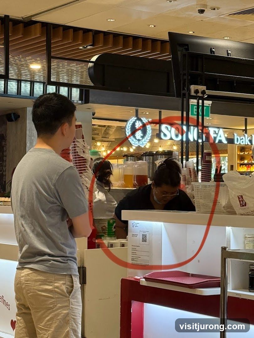 Staff serving customers at a food stall