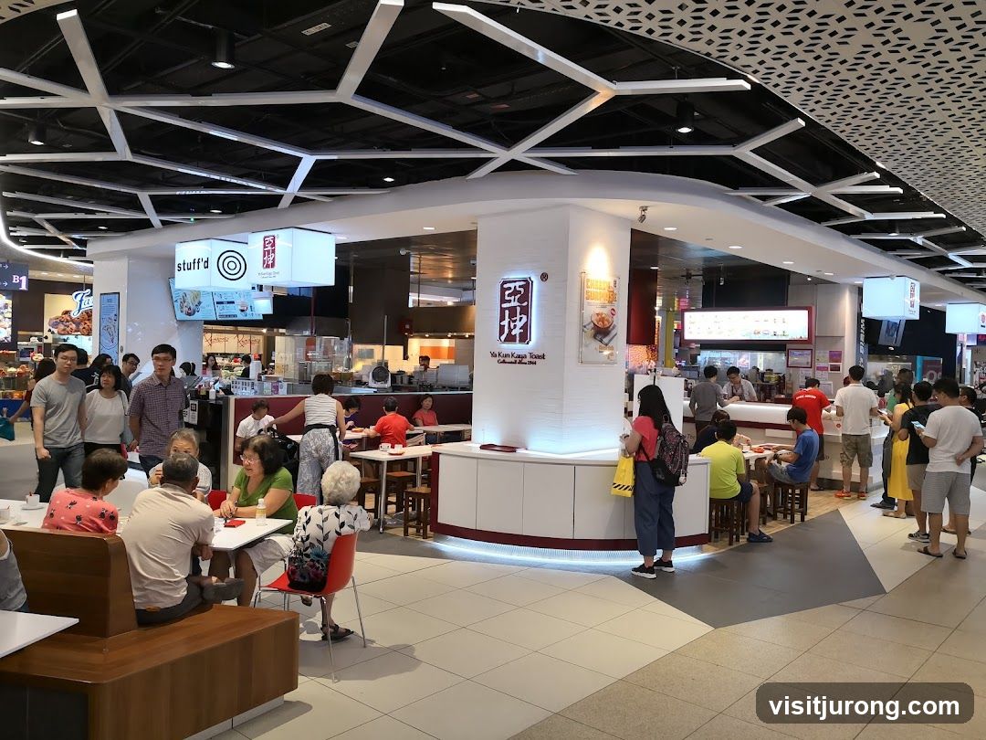 Food court with multiple stalls and seating areas