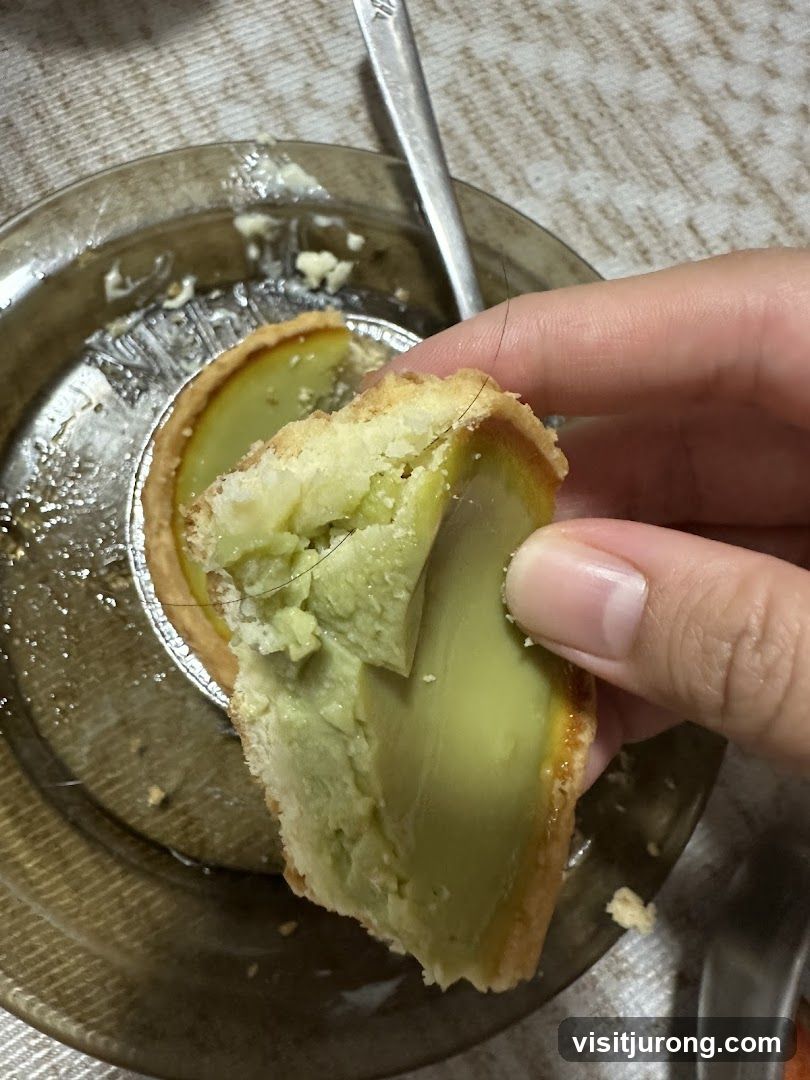 Close-up of a green tart with hair
