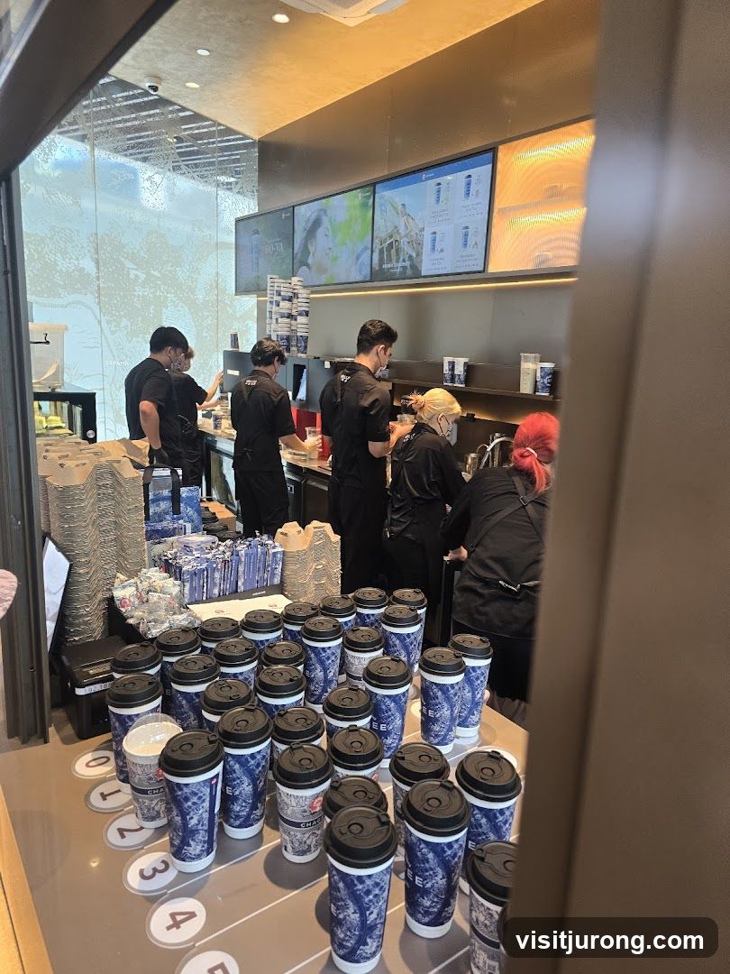 Coffee Shop Counter with Staff and Cups