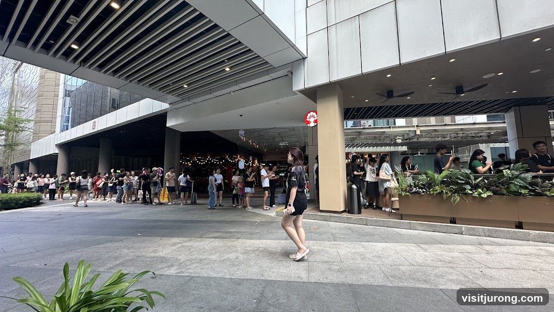People queuing outside a building