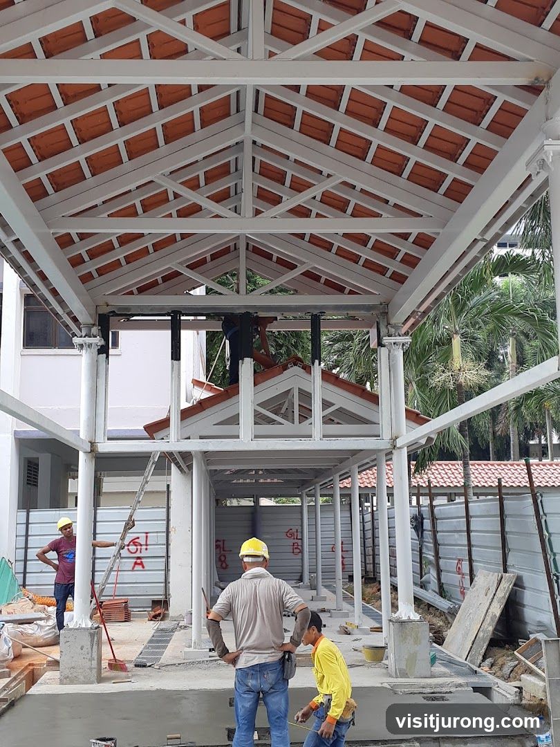 Construction workers on a covered walkway