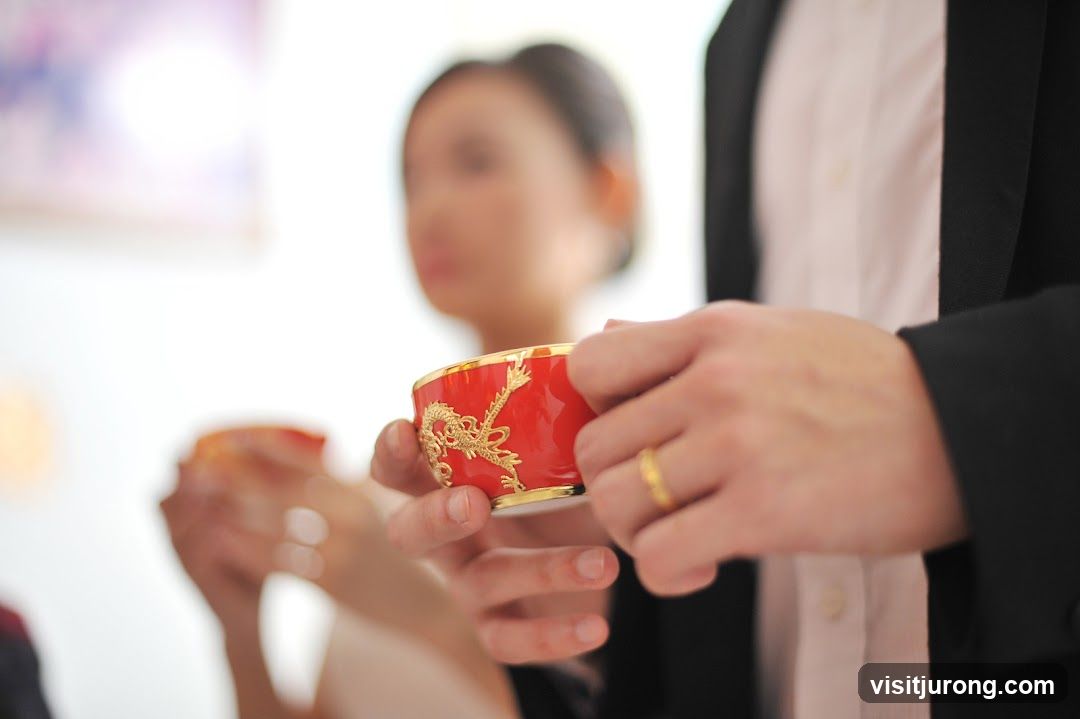 Couple holding tea cups