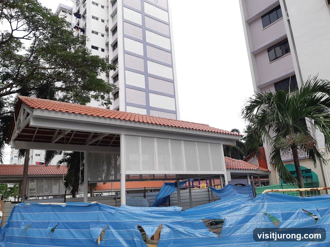 Under construction walkway with blue tarps