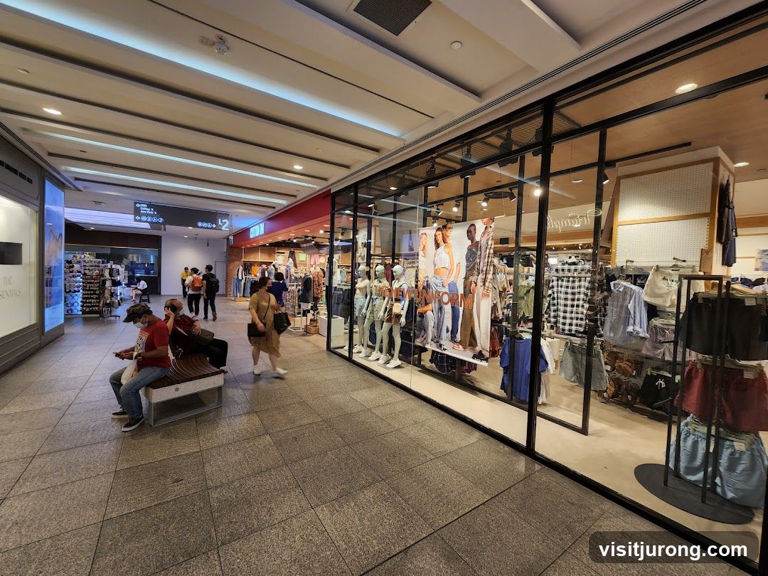 Clothing store interior with mannequins and apparel