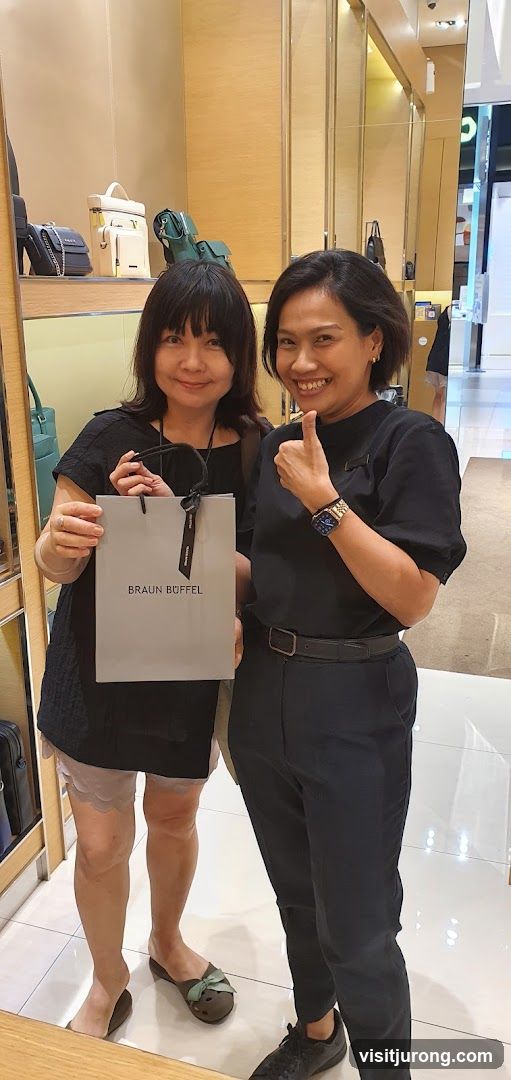 Two Women Posing with a Braun Buffel Shopping Bag
