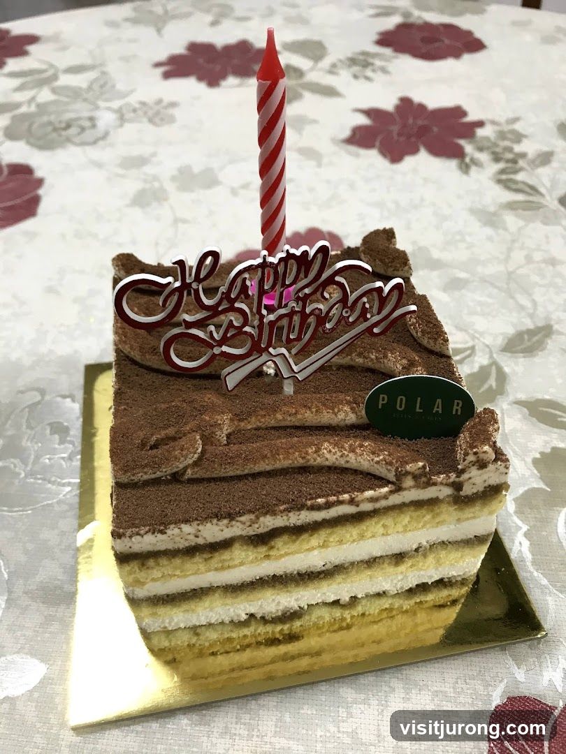 Tiramisu Cake Slice with Birthday Candle