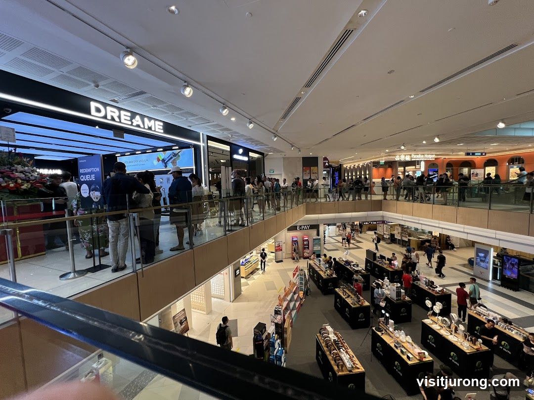 Shopping mall interior with stores and displays