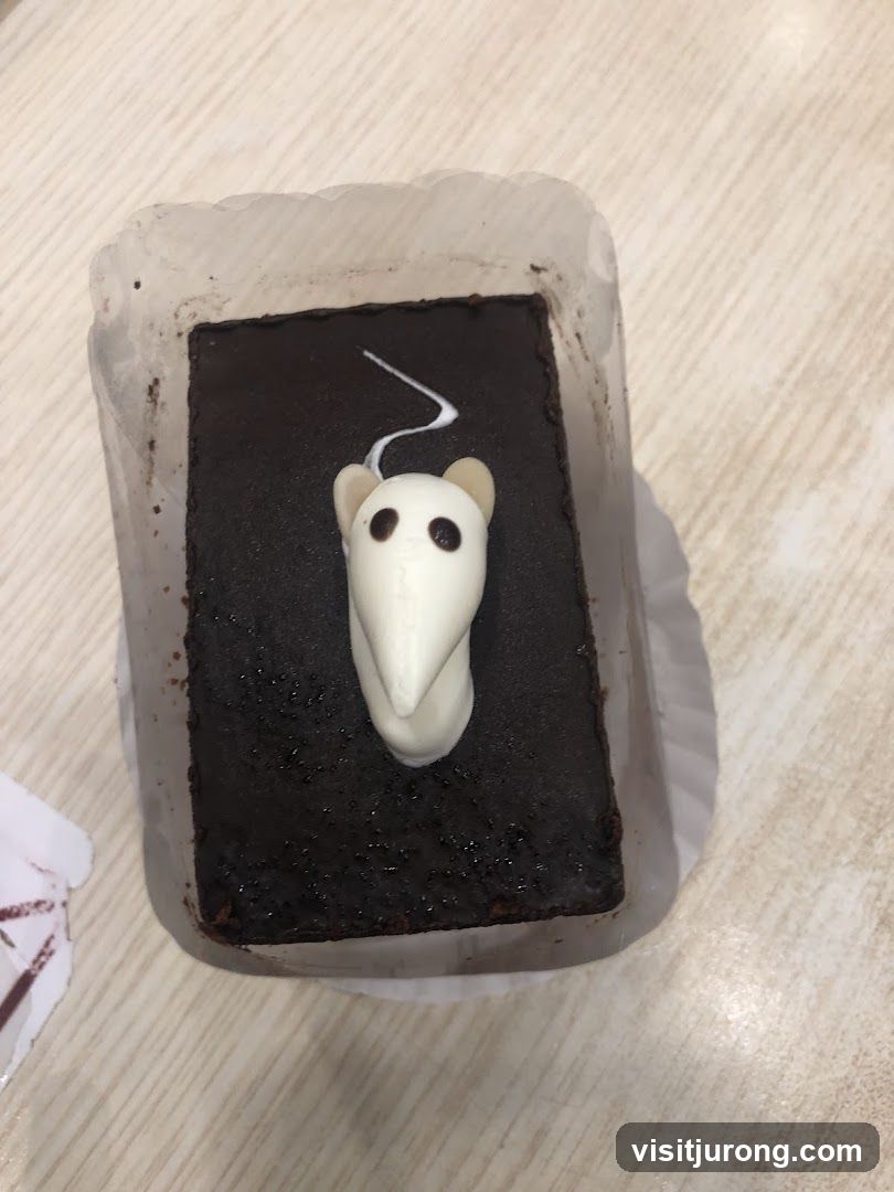 Chocolate cake with mouse decoration