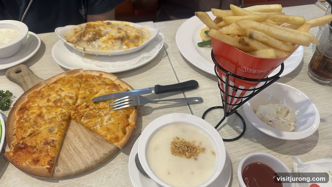 Table with Pizza, Fries, and Soup