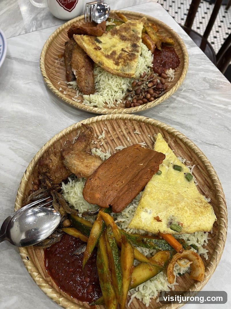 Two plates of Nasi Lemak