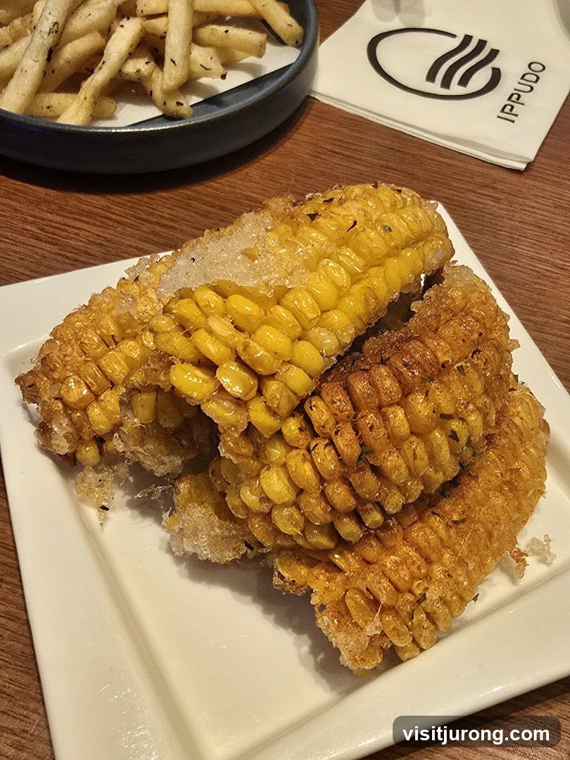 Corn on the cob and fries
