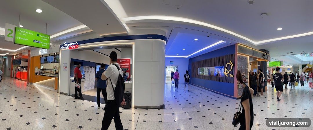 Indoor shopping mall corridor with various shops