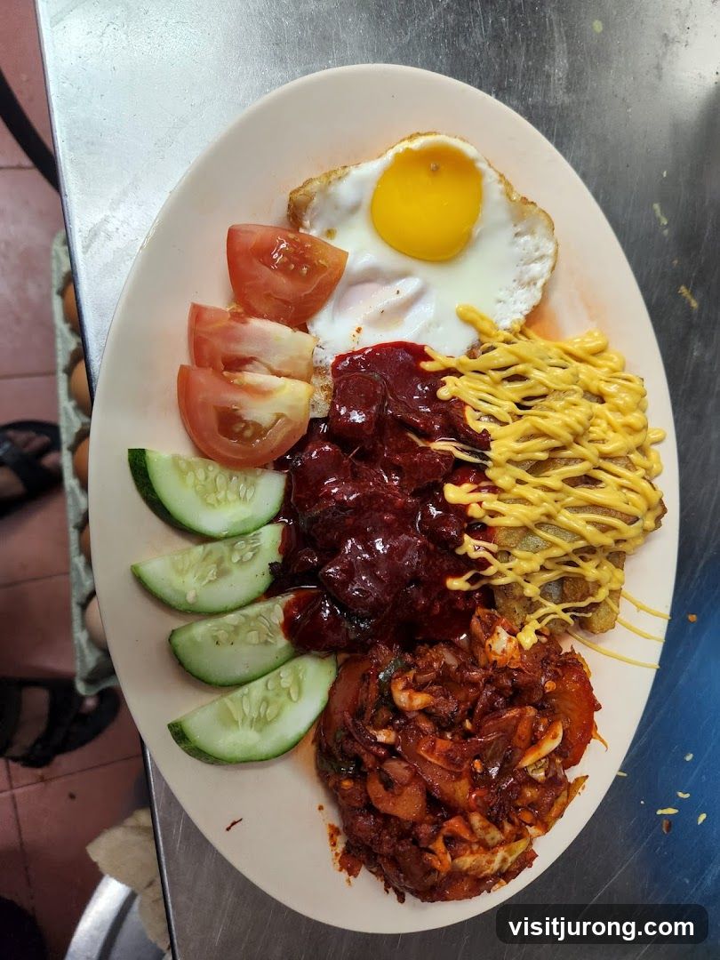 Plate of food with fried egg, cucumber, tomatoes, and meat dish