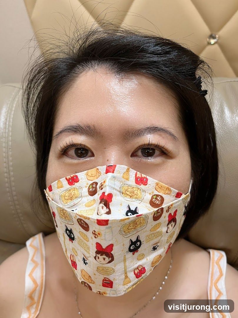 Woman wearing a Kiki's Delivery Service mask