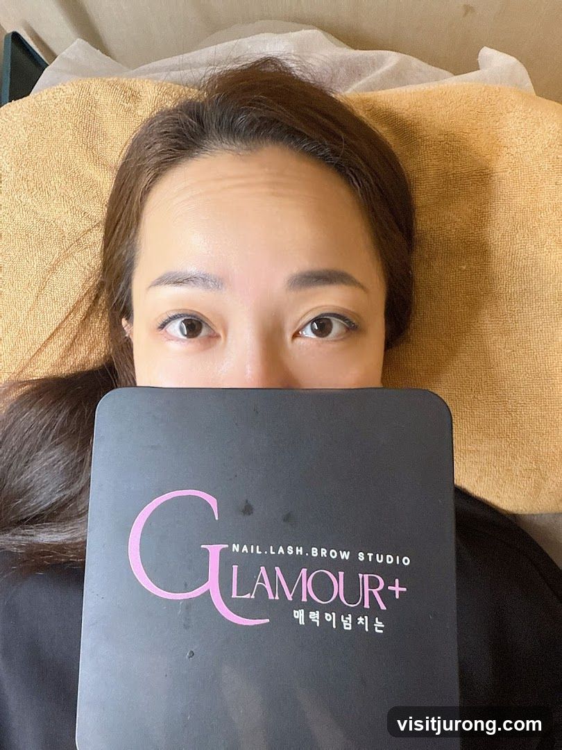 Woman holding a Glamour+ studio product