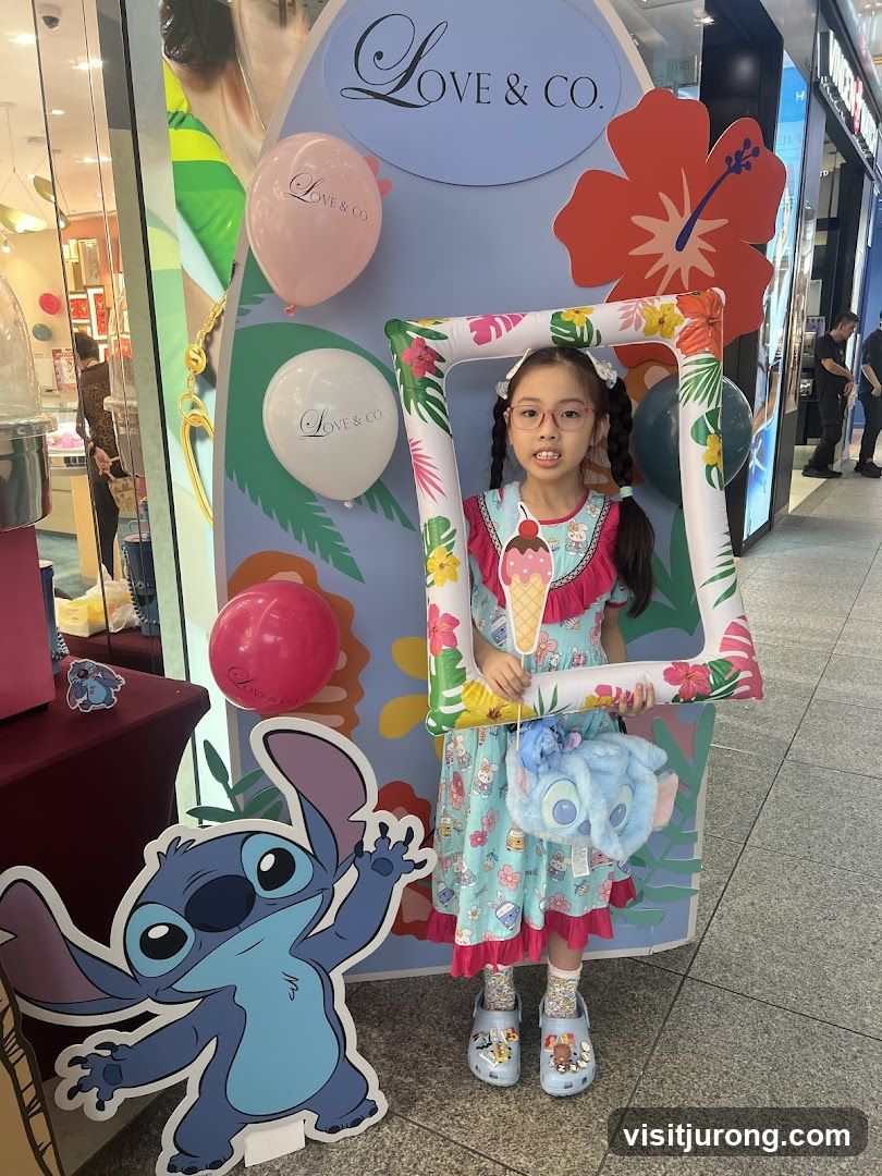 Girl Posing with Stitch and Love & Co. Display