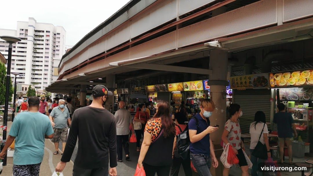 Busy Food Stalls Under a Covered Walkway
