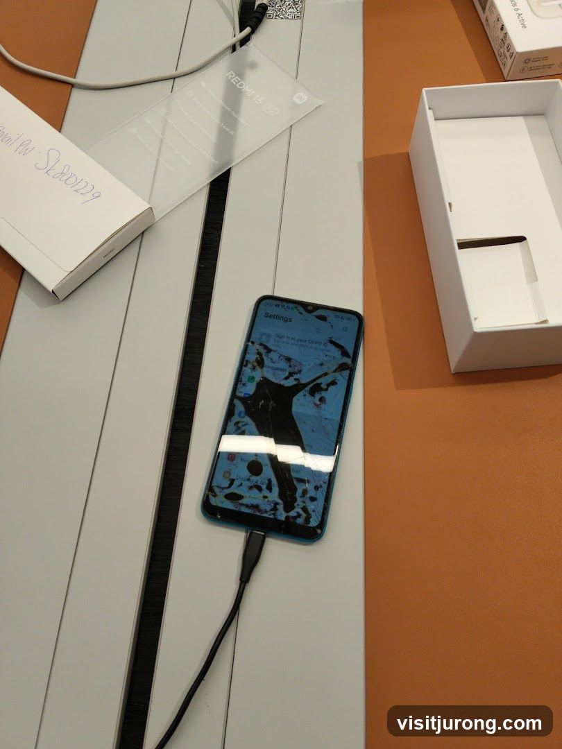 Damaged Smartphone and Packaging